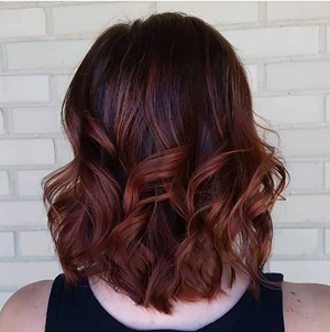 Auburn curled hair