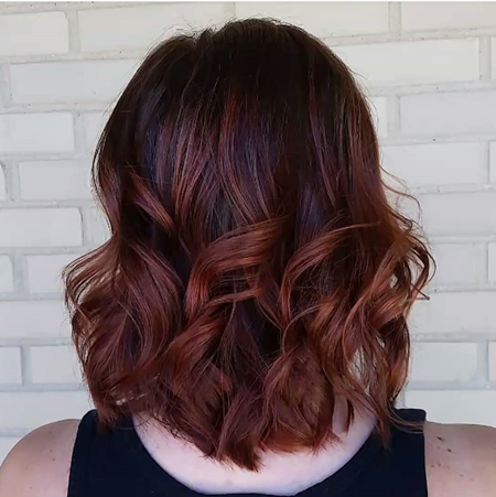 Auburn curled hair